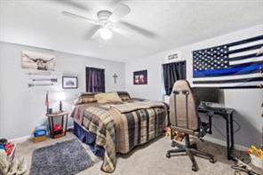 118 Constitution Street Perryopolis, PA 15473 - Photo 31 of 34 a bed room with a bed a chair and a chandelier