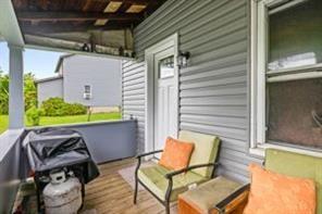 118 Constitution Street Perryopolis, PA 15473 - Photo 4 of 34 a view of a chair and tables in the balcony