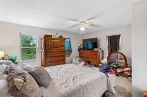 a bedroom with a bed and furniture