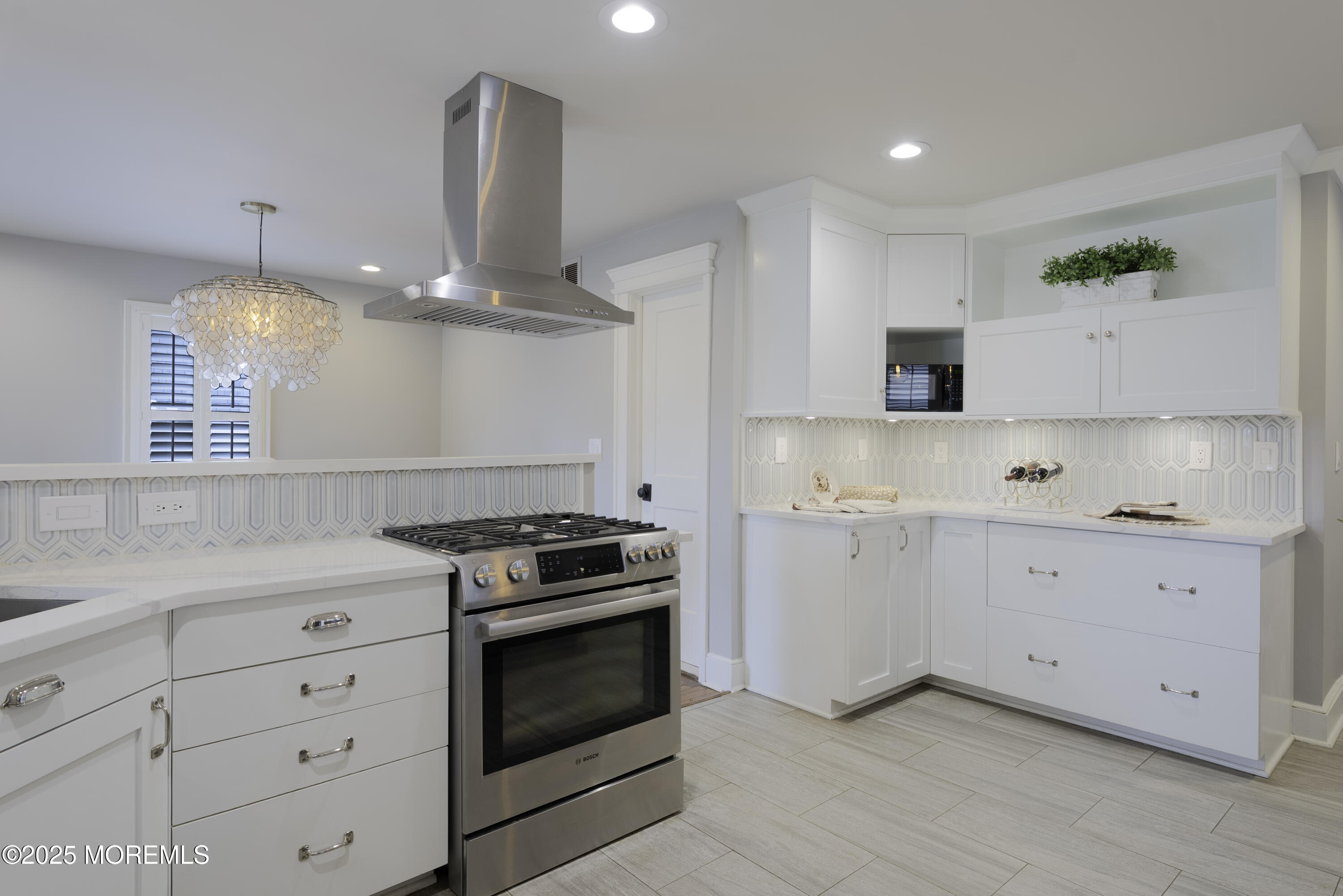 7 Allen Street Rumson, NJ 07760 - Photo 13 of 36 a kitchen with white cabinets and stainless steel appliances