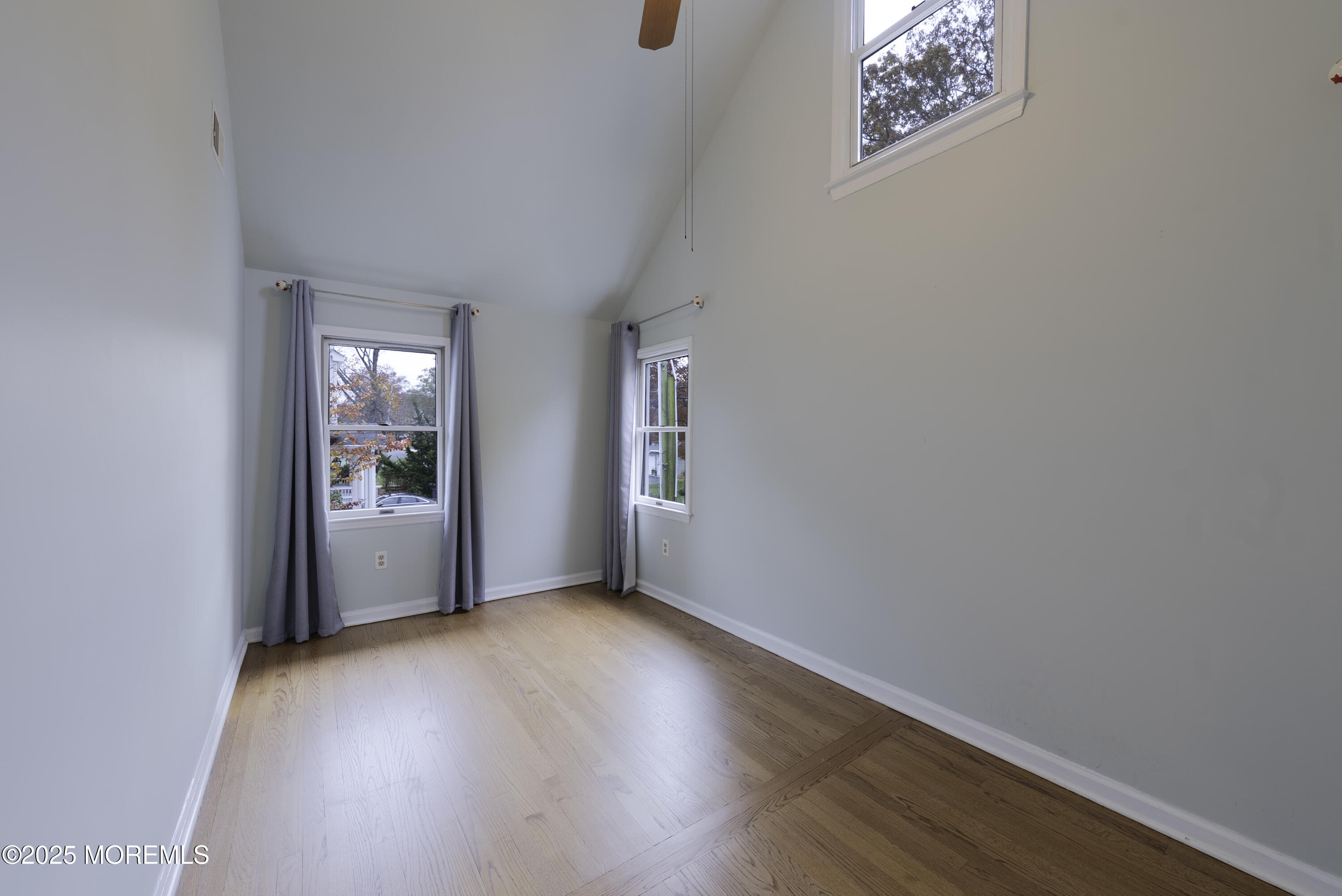 7 Allen Street Rumson, NJ 07760 - Photo 20 of 36 an empty room with wooden floor and windows