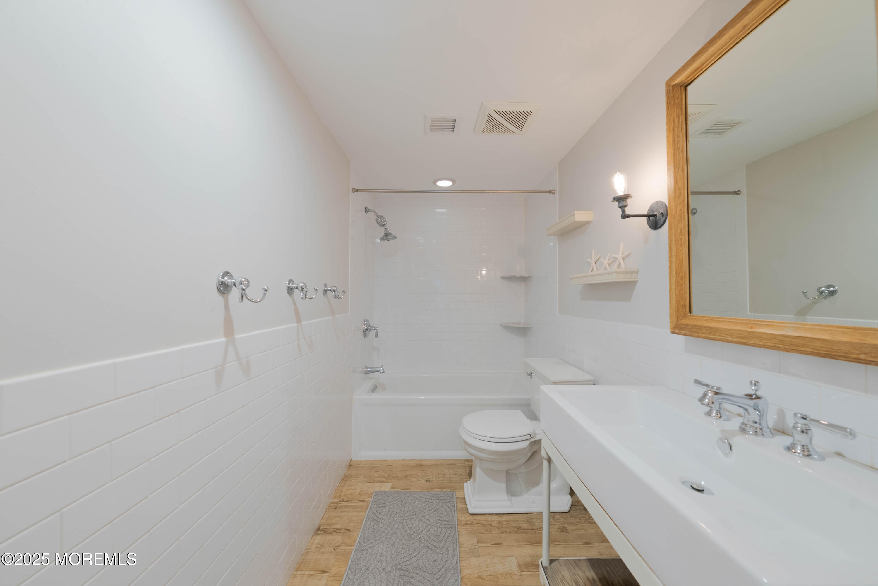 7 Allen Street Rumson, NJ 07760 - Photo 22 of 36 a bathroom with a sink a toilet and shower