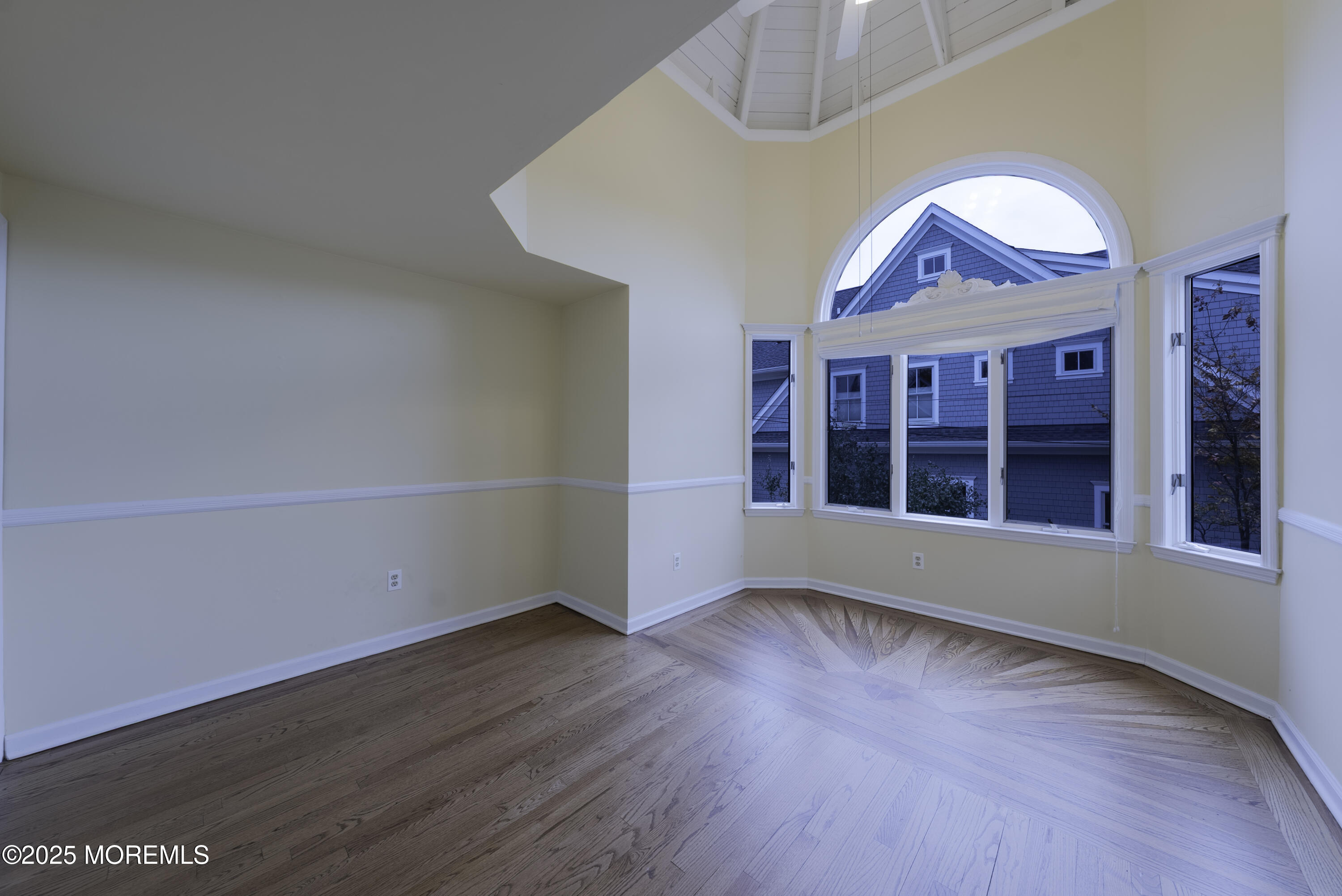 7 Allen Street Rumson, NJ 07760 - Photo 23 of 36 a view of an empty room with wooden floor and a window