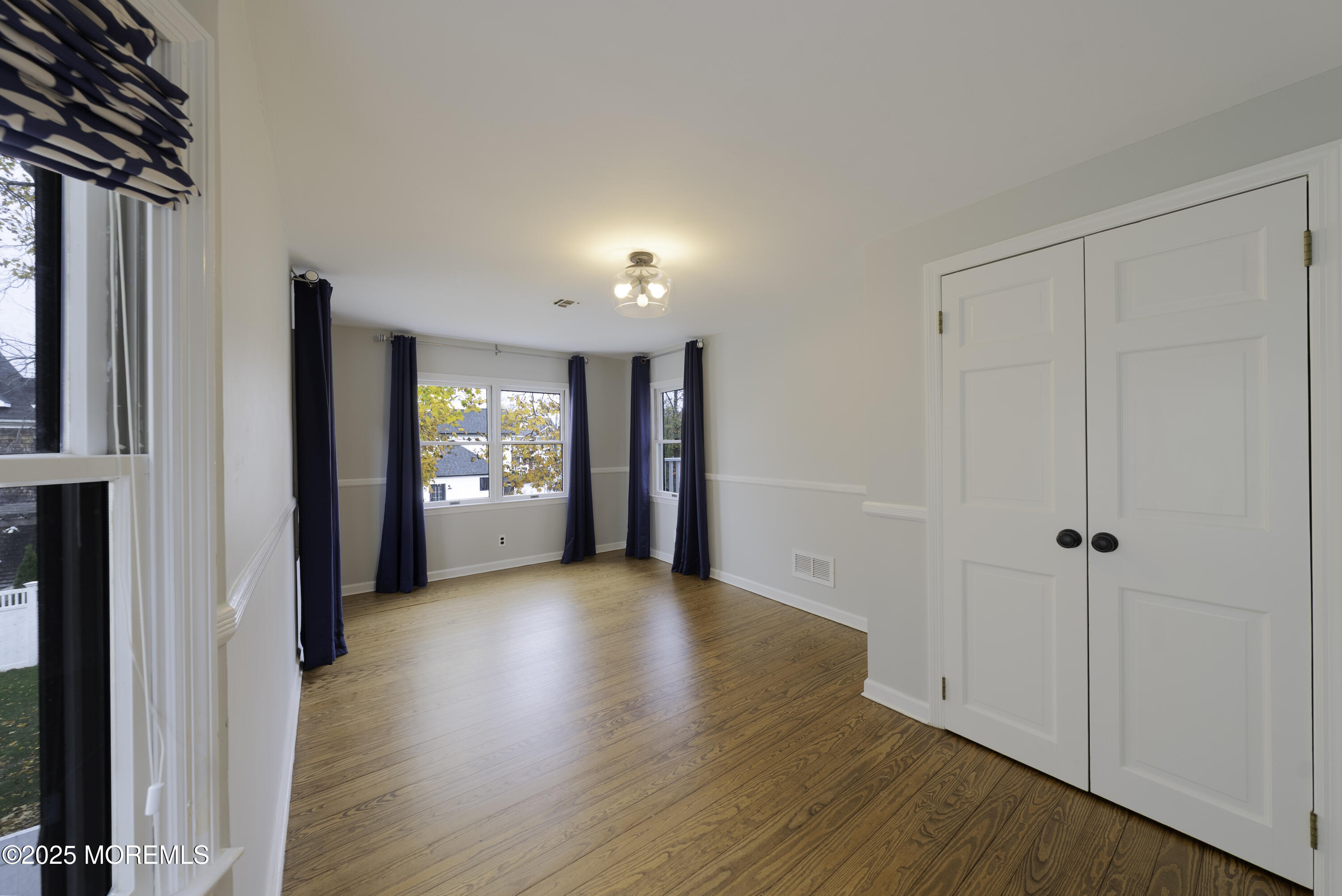 7 Allen Street Rumson, NJ 07760 - Photo 25 of 36 a view of a hallway with wooden floor and closet area