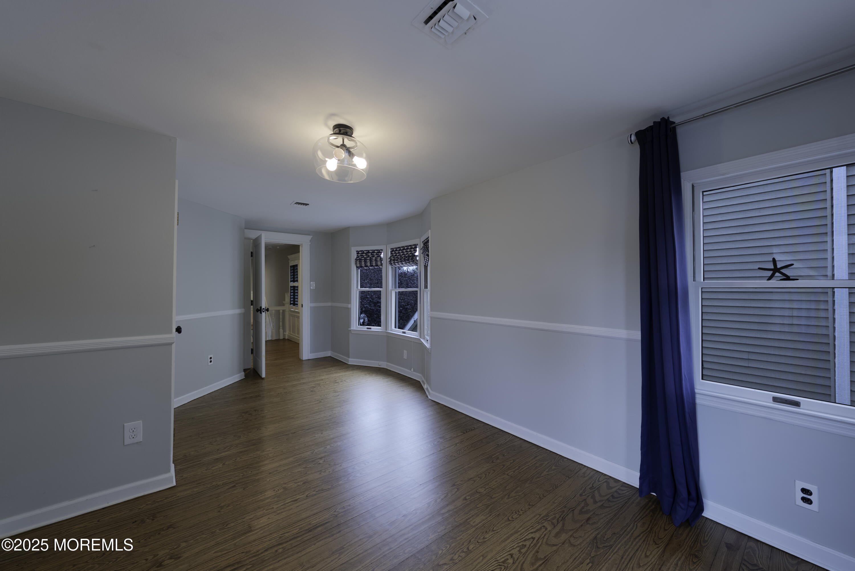 7 Allen Street Rumson, NJ 07760 - Photo 26 of 36 a view of a livingroom with wooden floor and a ceiling fan