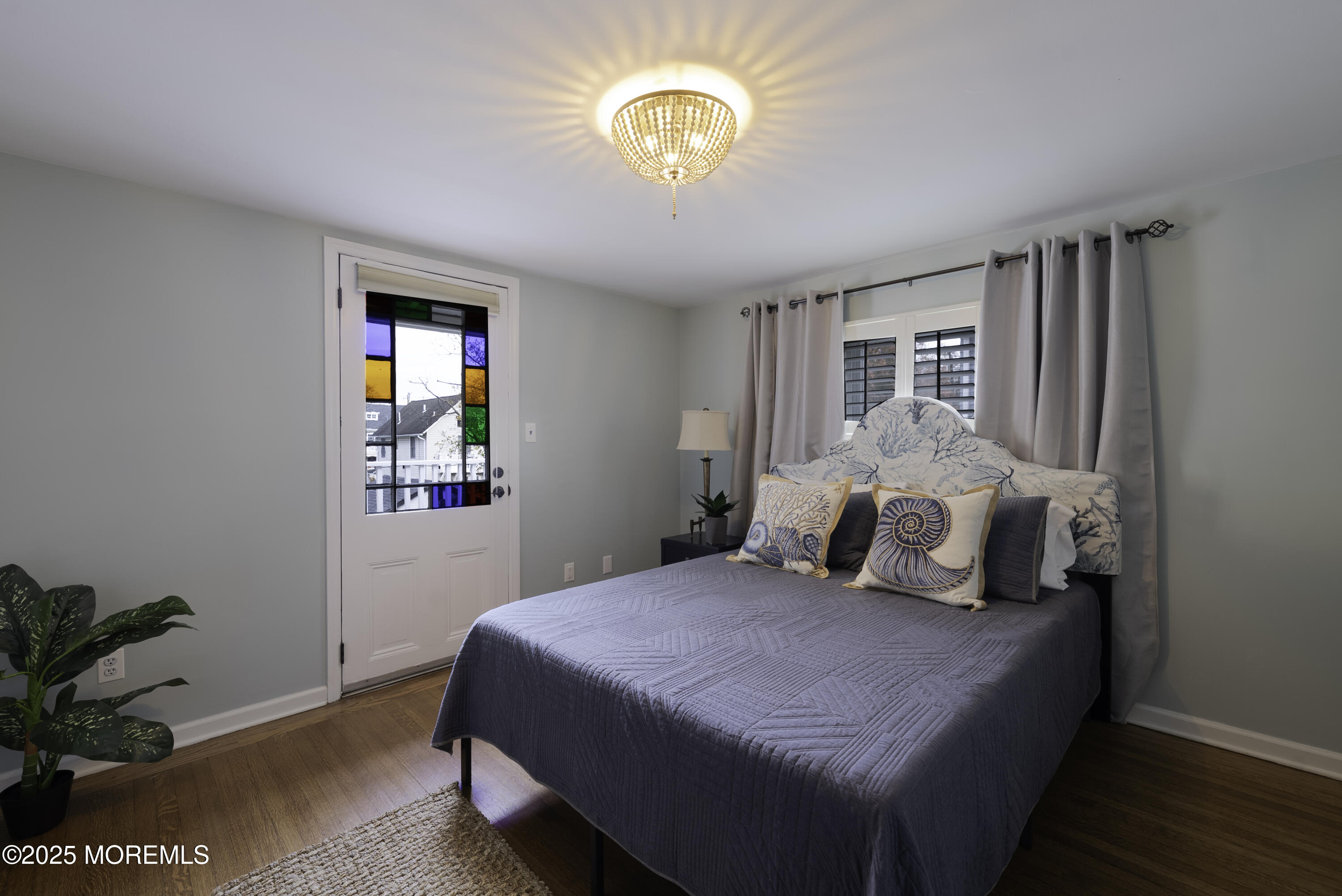 7 Allen Street Rumson, NJ 07760 - Photo 27 of 36 a bedroom with a bed and a potted plant