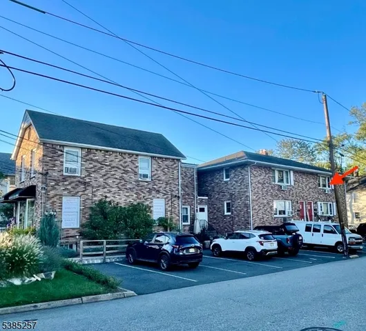 a view of car parked in front of house