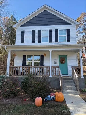 a front view of a house with swimming pool