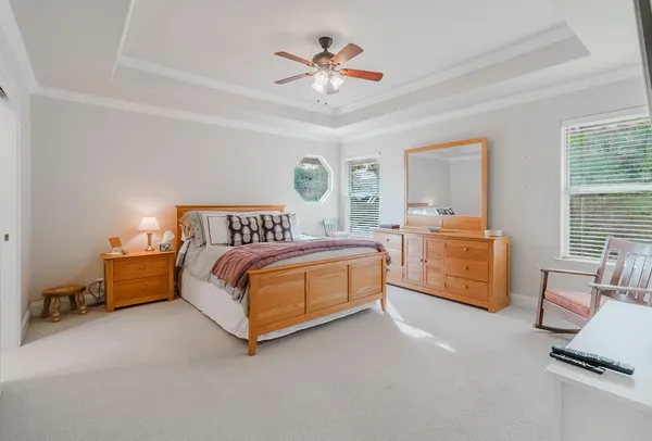 a bedroom with furniture and a bed