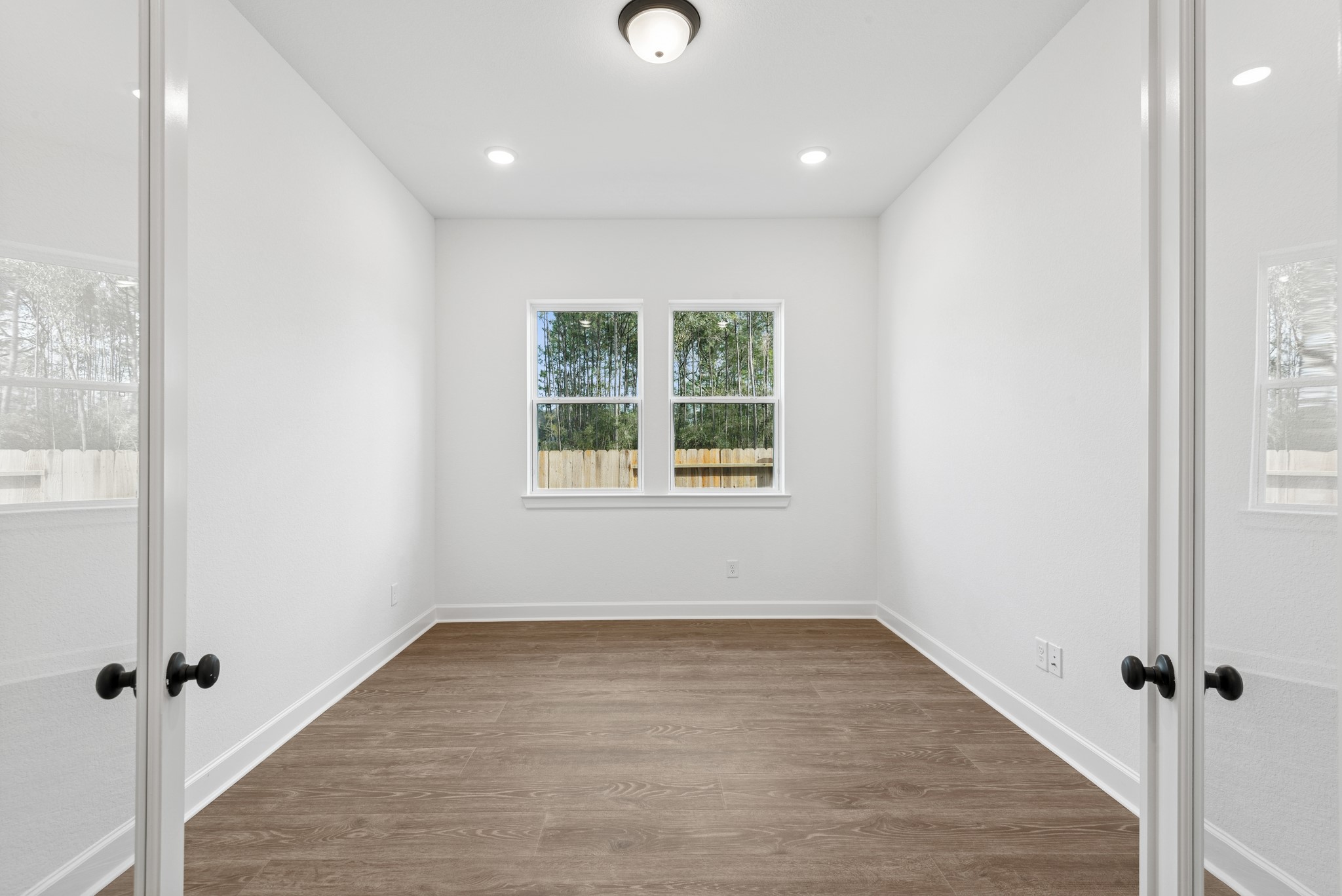 15714 Terracotta Terrace Lane Conroe, TX 77302 - Photo 16 of 47 an empty room with windows