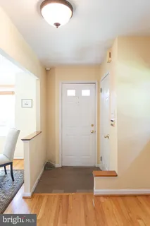 a view of room with window and wooden floor