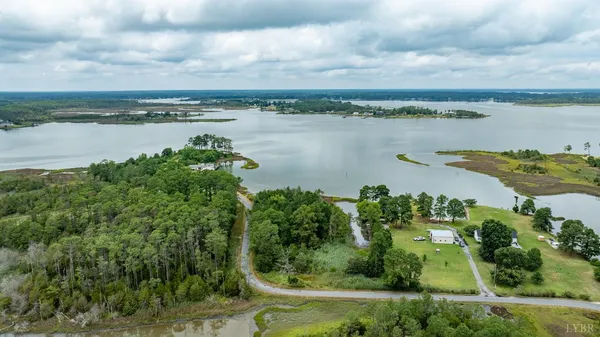 a view of a lake with a yard