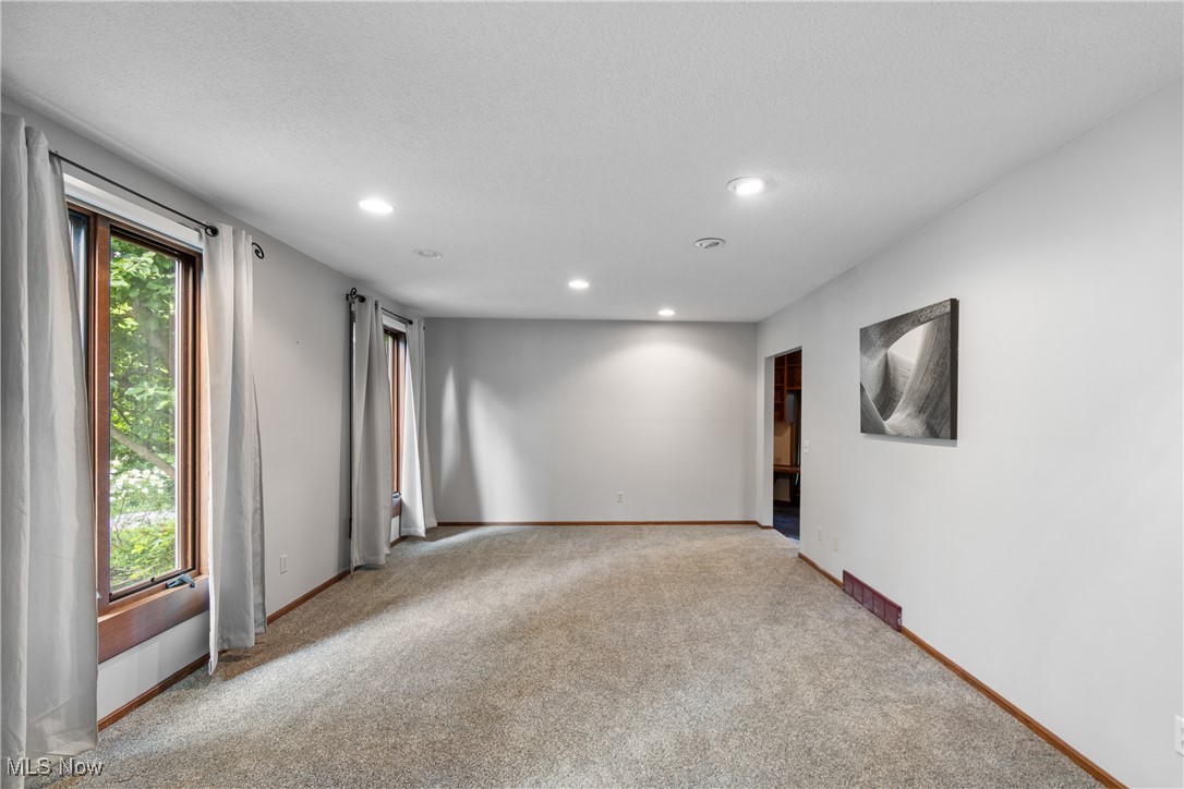 2317 Raintree Street Northeast Canton, OH 44705 - Photo 5 of 40 Carpeted empty room with baseboards and recessed lighting