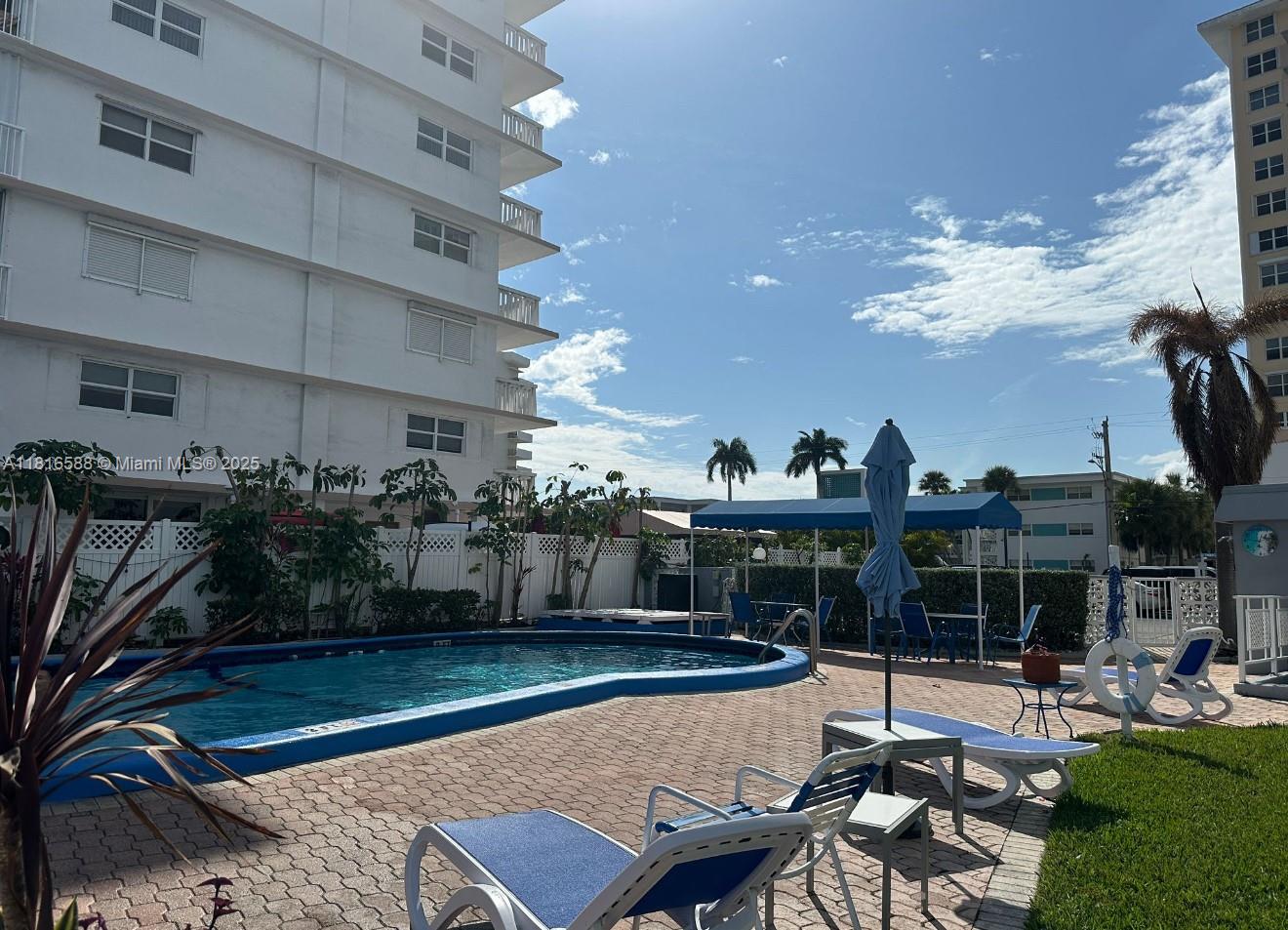 430 Golden Isles Drive, Unit 301 Hallandale Beach, FL 33009 - Photo 16 of 20 Pool with water view