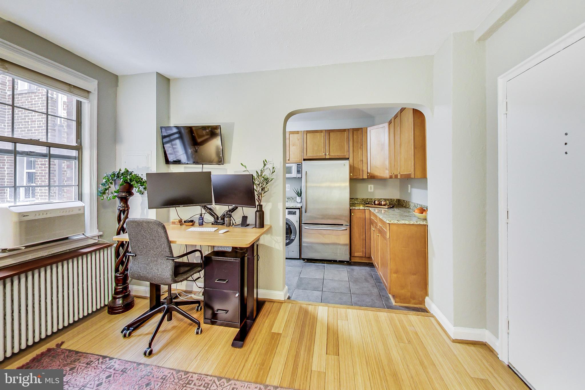 1441 Euclid Street Northwest, Unit 105 Washington, DC 20009 - Photo 5 of 20 a dining room with furniture and wooden floor