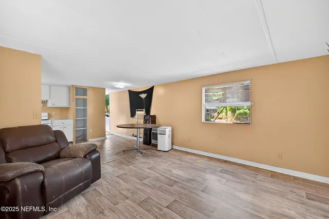 a kitchen with stainless steel appliances granite countertop a refrigerator sink and cabinets