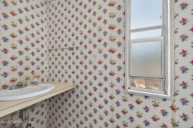 a view of balcony with wooden floor and fence