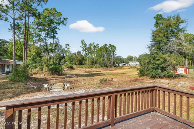 a backyard of a house with fountain and outdoor seating