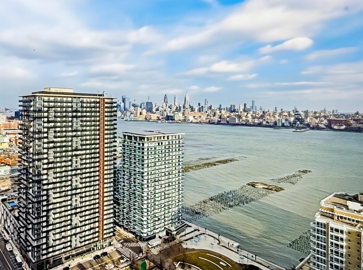 75 Park Lane South, Unit 3202 Jersey City, NJ 07310 - Photo 13 of 40 a view of a city with ocean