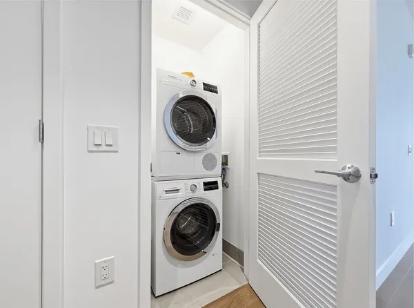 a utility room with dryer and washer