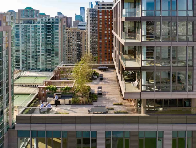 a view of swimming pool with outdoor seating