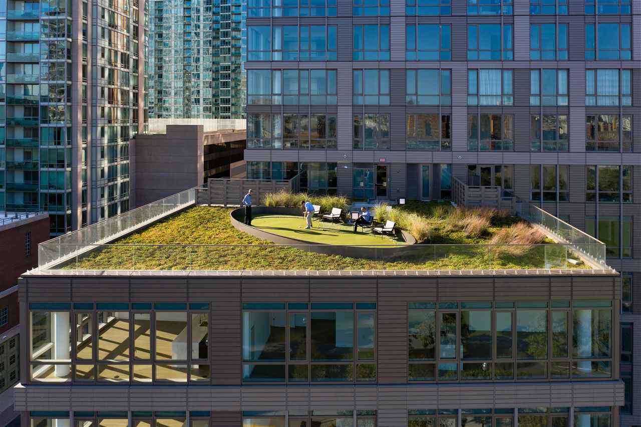 75 Park Lane South, Unit 3202 Jersey City, NJ 07310 - Photo 35 of 40 a view of swimming pool with outdoor seating