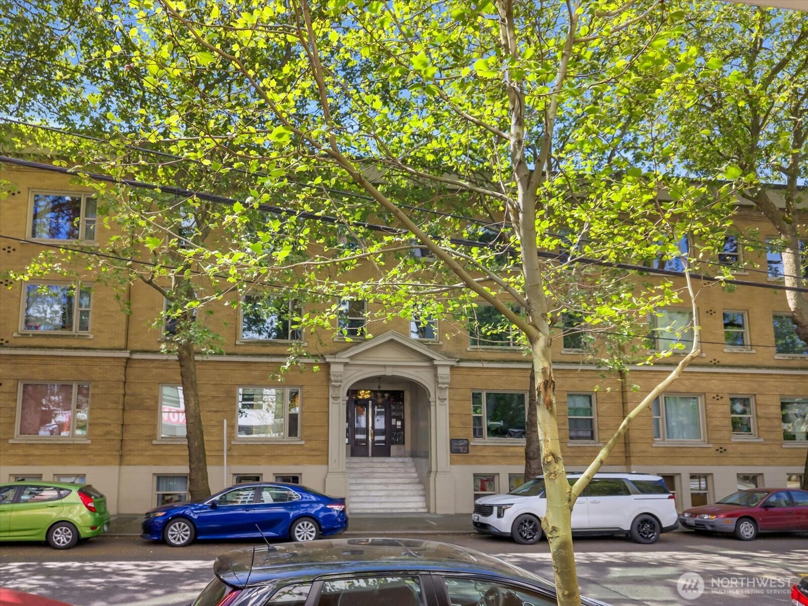 7 Harrison Street, Unit 17 Seattle, WA 98109 - Photo 3 of 20 a car parked in front of a building