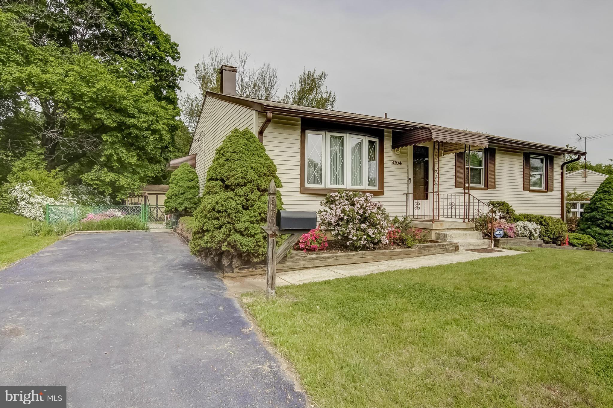 3704 Vega Road Randallstown, MD 21133 - Photo 1 of 25 a front view of a house with garden
