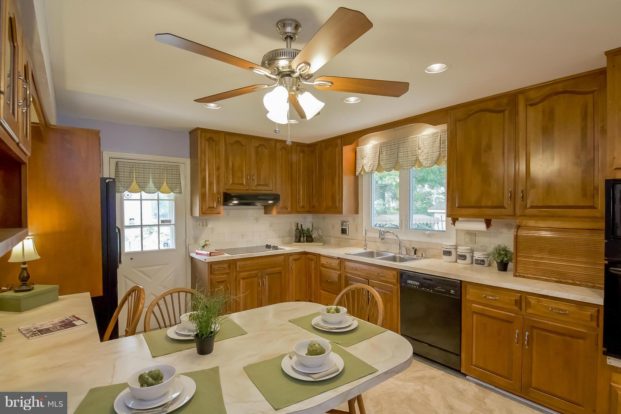 3704 Vega Road Randallstown, MD 21133 - Photo 2 of 25 a kitchen with a sink and stove