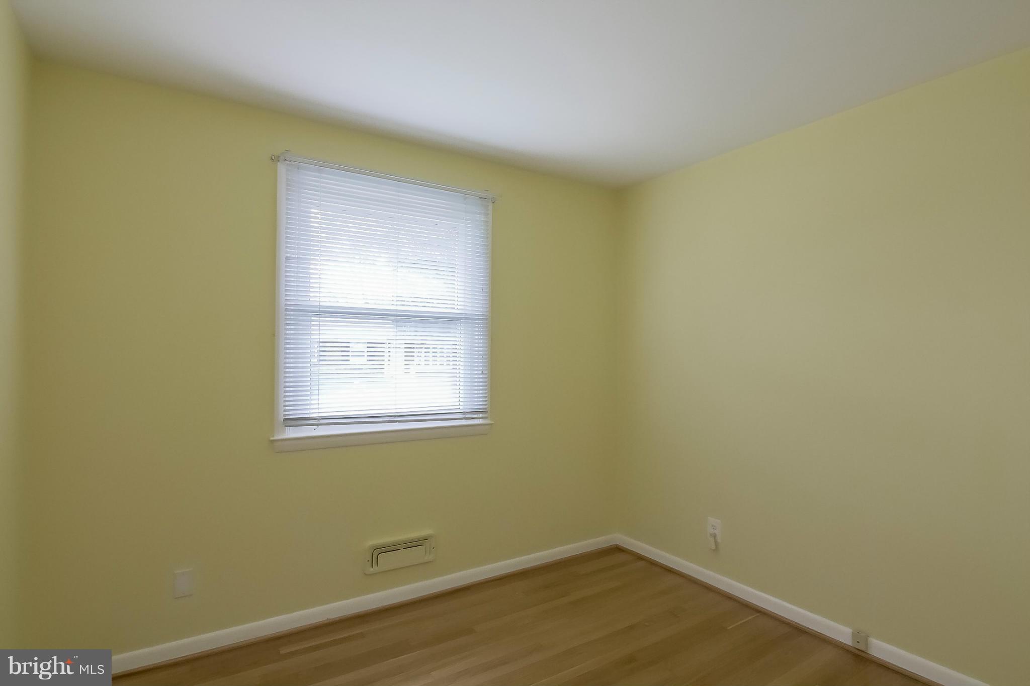 3704 Vega Road Randallstown, MD 21133 - Photo 13 of 25 a view of a small space with wooden floor and a window
