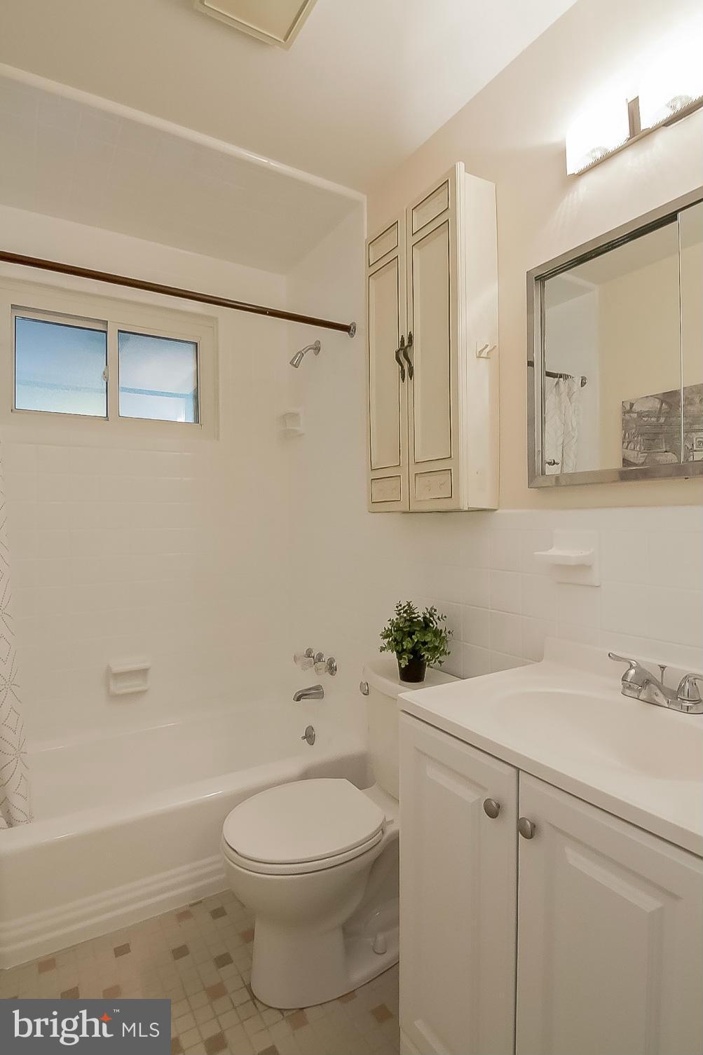 3704 Vega Road Randallstown, MD 21133 - Photo 15 of 25 a bathroom with a sink a toilet and shower
