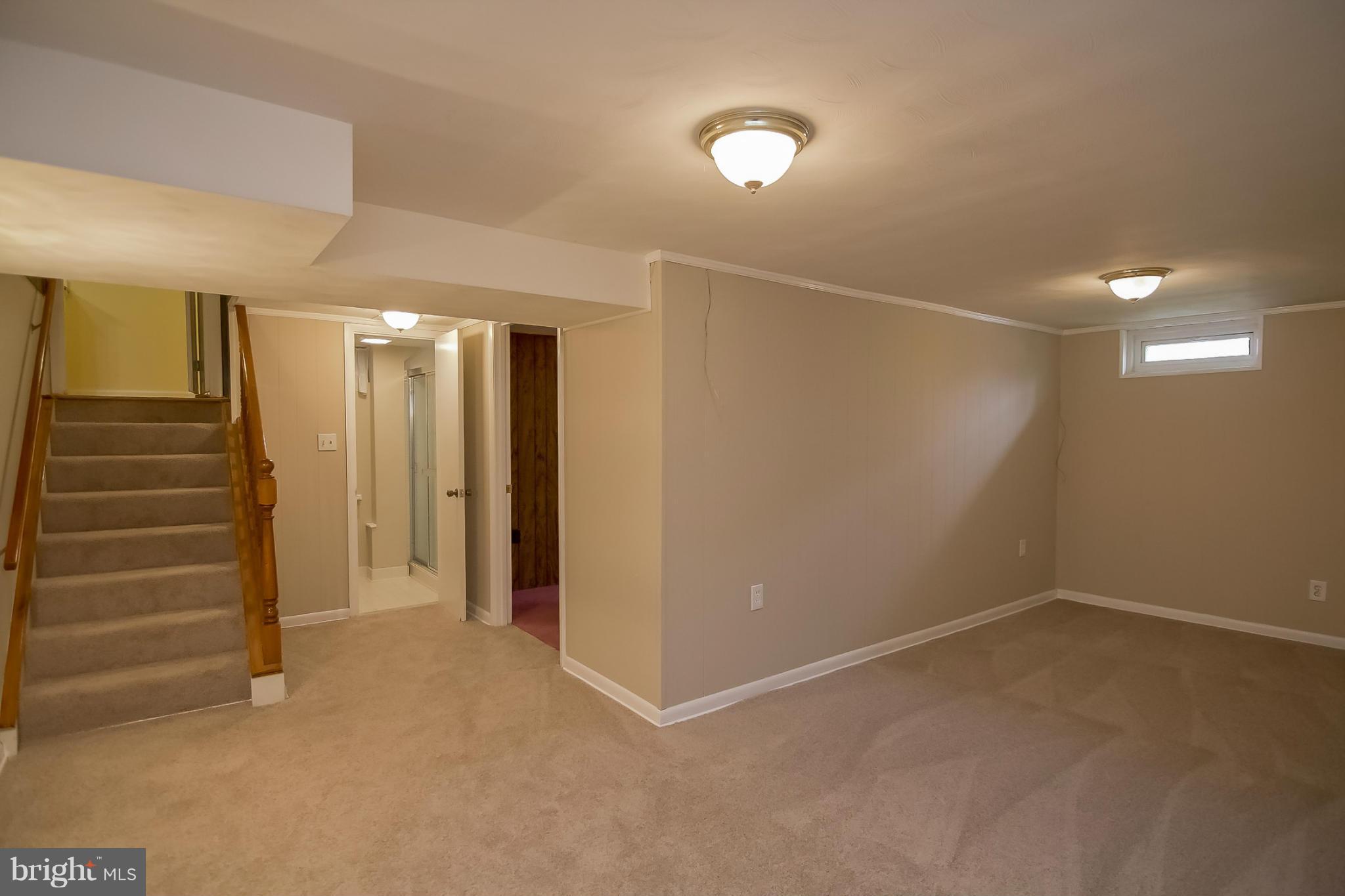 3704 Vega Road Randallstown, MD 21133 - Photo 16 of 25 a view of an empty room with stairs