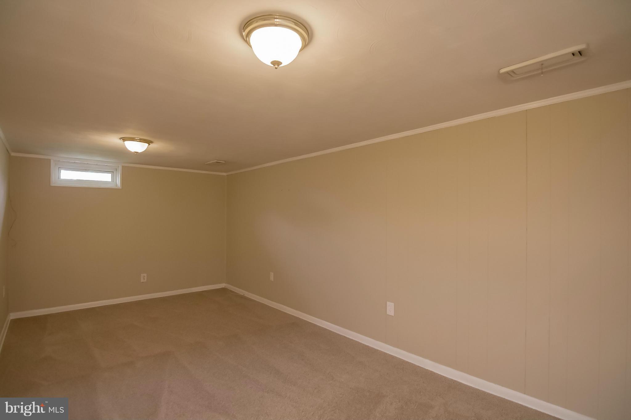 3704 Vega Road Randallstown, MD 21133 - Photo 17 of 25 a view of a room with racks on the wall