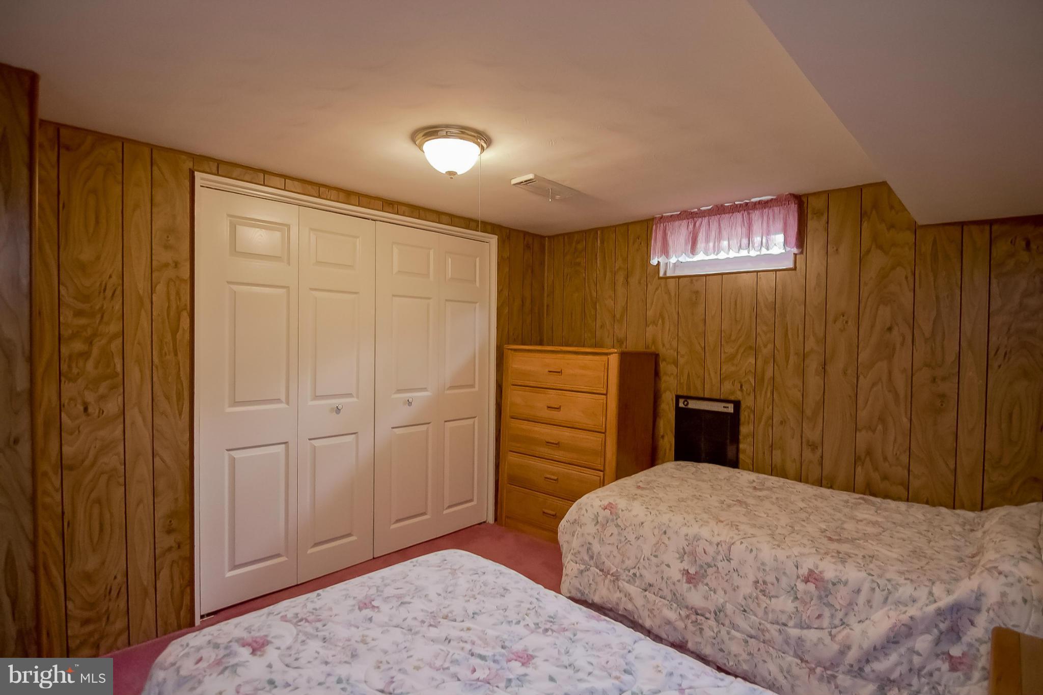 3704 Vega Road Randallstown, MD 21133 - Photo 19 of 25 a bedroom with a bed and a dresser