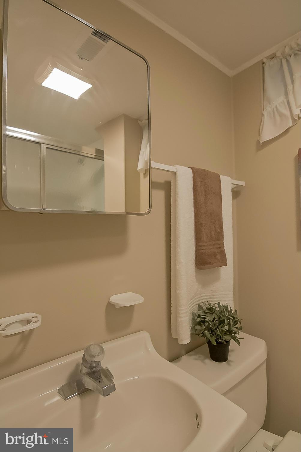 3704 Vega Road Randallstown, MD 21133 - Photo 20 of 25 a bathroom with a sink a toilet and shower
