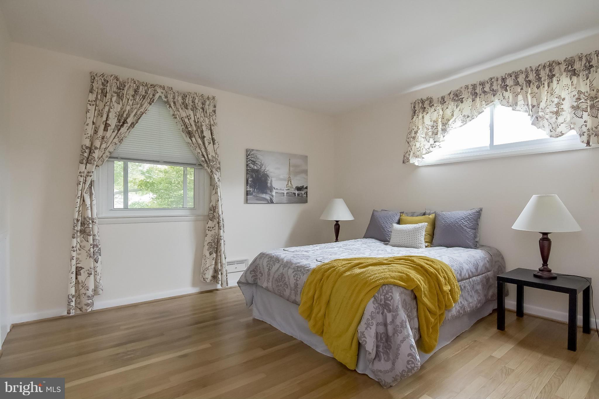 3704 Vega Road Randallstown, MD 21133 - Photo 3 of 25 a bedroom with a bed and a window