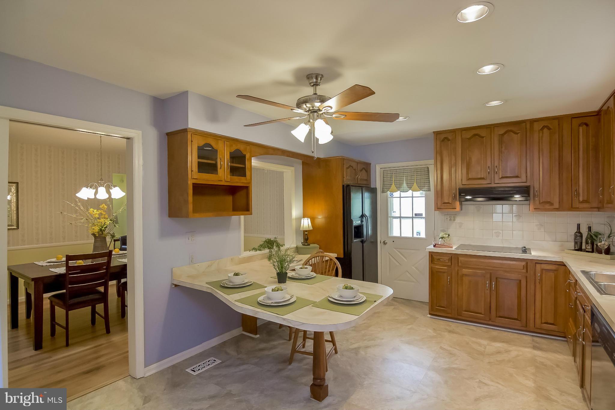 3704 Vega Road Randallstown, MD 21133 - Photo 8 of 25 a kitchen with cabinets a sink and appliances