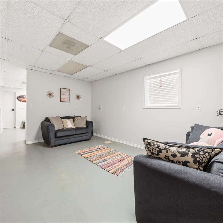 785 Tweedy Road Valley Mills, TX 76689 - Photo 28 of 40 Spacious room with light gray walls, drop ceiling, and a single window with white blinds