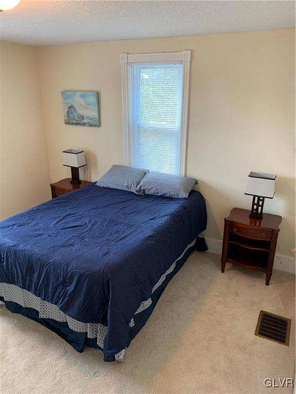 2161 East Scenic Drive Bath, PA 18014 - Photo 17 of 27 a bedroom with a bed and a window