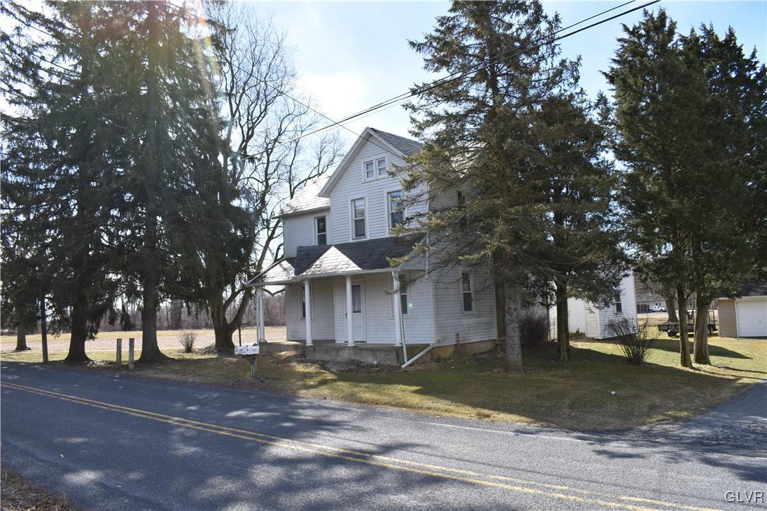 2161 East Scenic Drive Bath, PA 18014 - Photo 2 of 27 a front view of a house with a yard