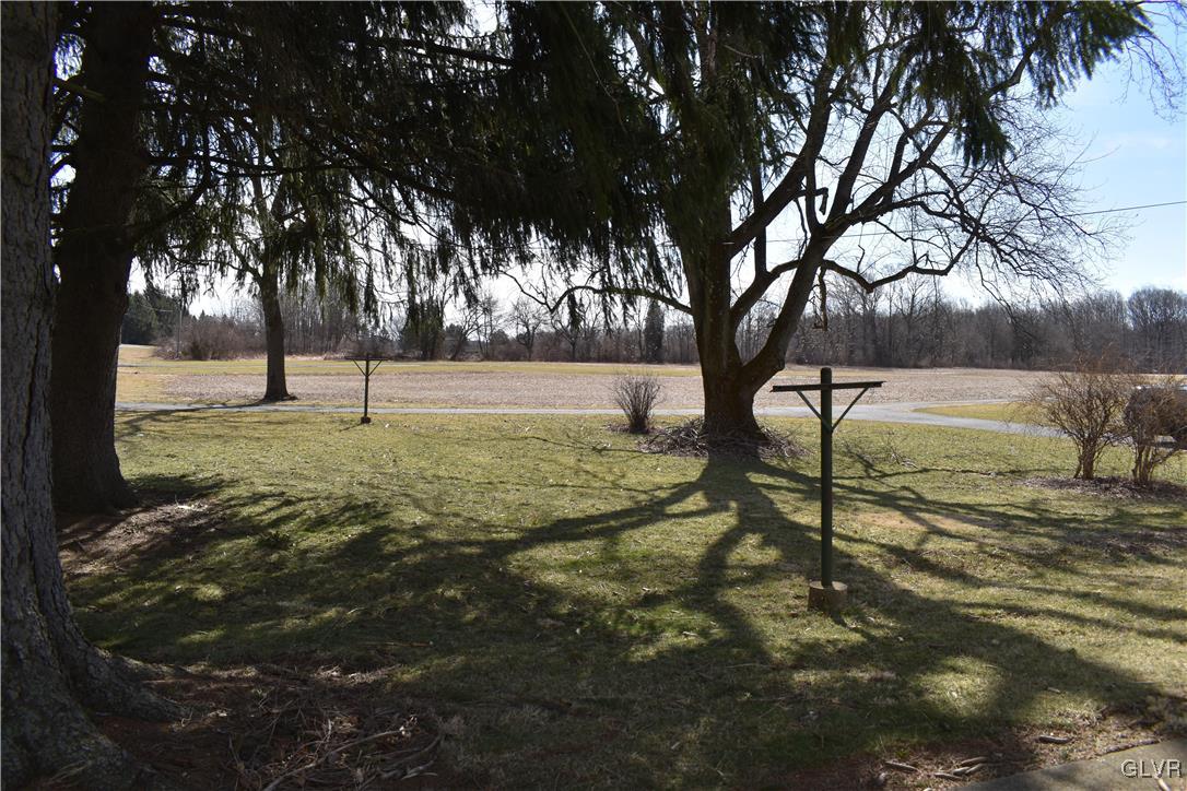 2161 East Scenic Drive Bath, PA 18014 - Photo 24 of 27 a view of a backyard with large trees
