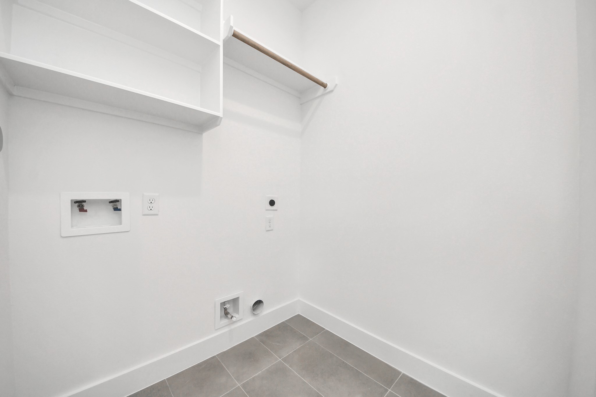 505 Middle Street Houston, TX 77003 - Photo 30 of 46 This bright and spacious laundry room offers ample shelving and modern hookups, ensuring a streamlined and efficient laundry experience.