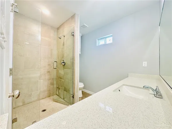 a spacious bathroom with a double vanity sink mirror and