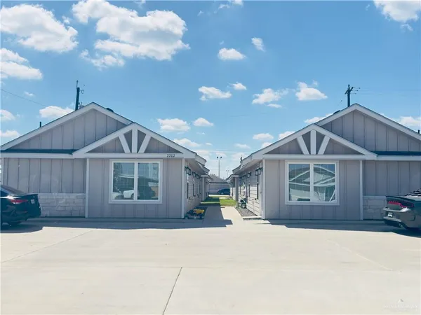 a house with swimming pool in front of it