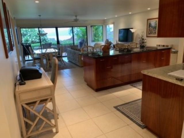 50 Puu Anoano Street, Unit 1801 Lahaina, HI 96761 - Photo 5 of 8 a kitchen with stainless steel appliances kitchen island granite countertop a sink and a stove