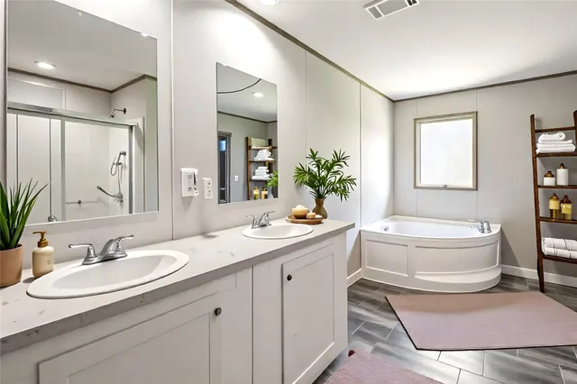 a bathroom with a sink and mirror with toilet