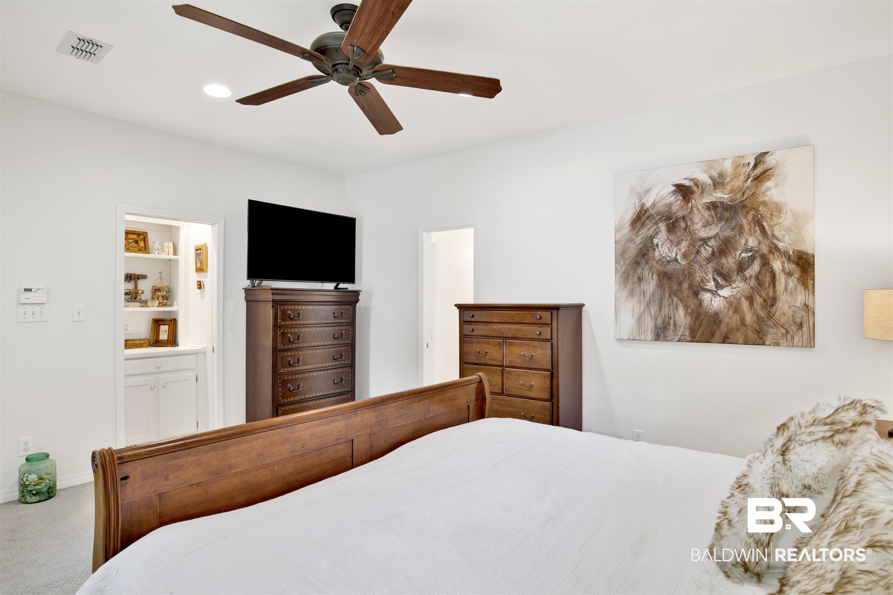 107 McIntosh Bluff Road Fairhope, AL 36532 - Photo 22 of 43 Carpeted bedroom with ensuite bath and ceiling fan