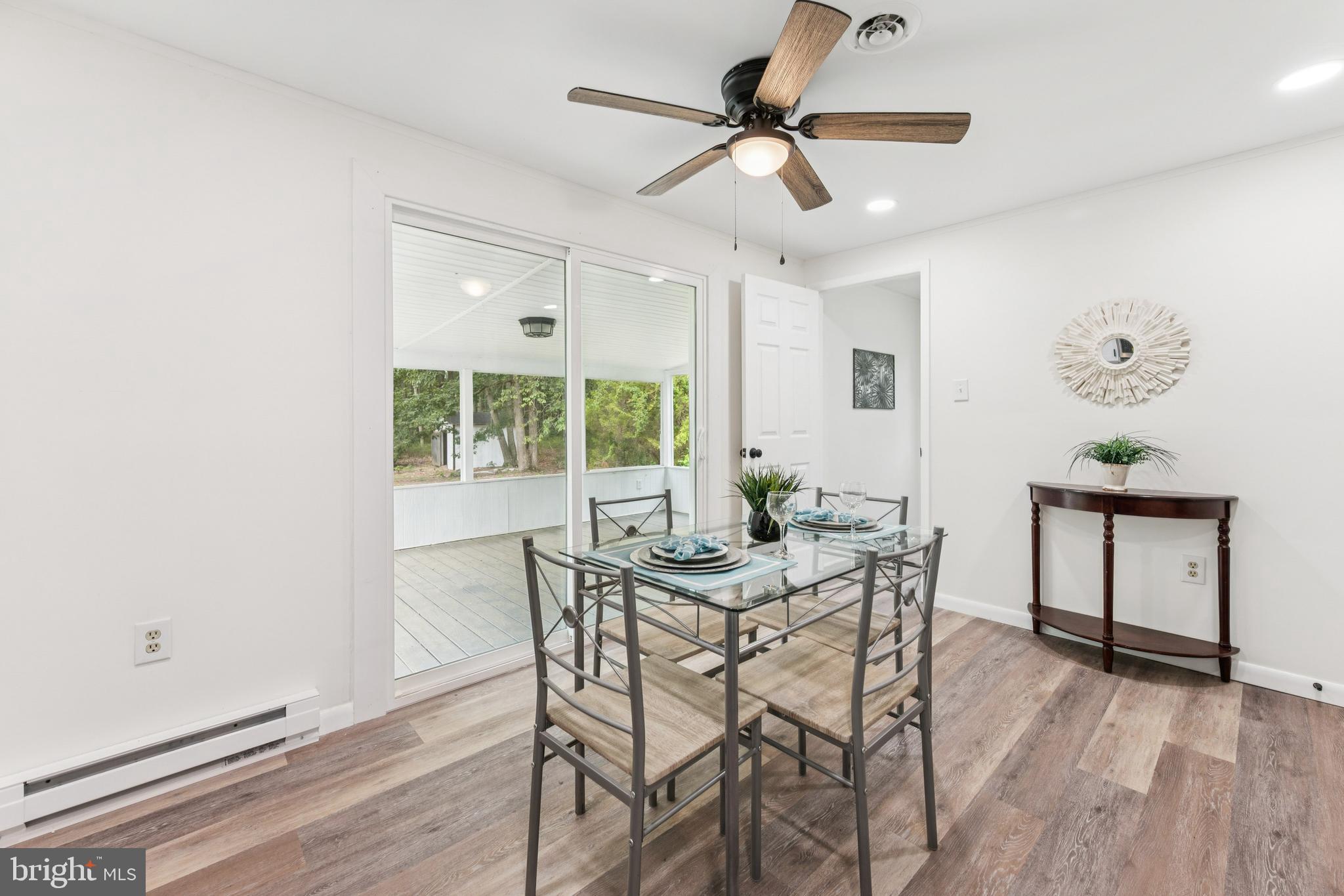 651 Erial Road Sicklerville, NJ 08081 - Photo 11 of 24 a view of a dining room with furniture window and wooden floor