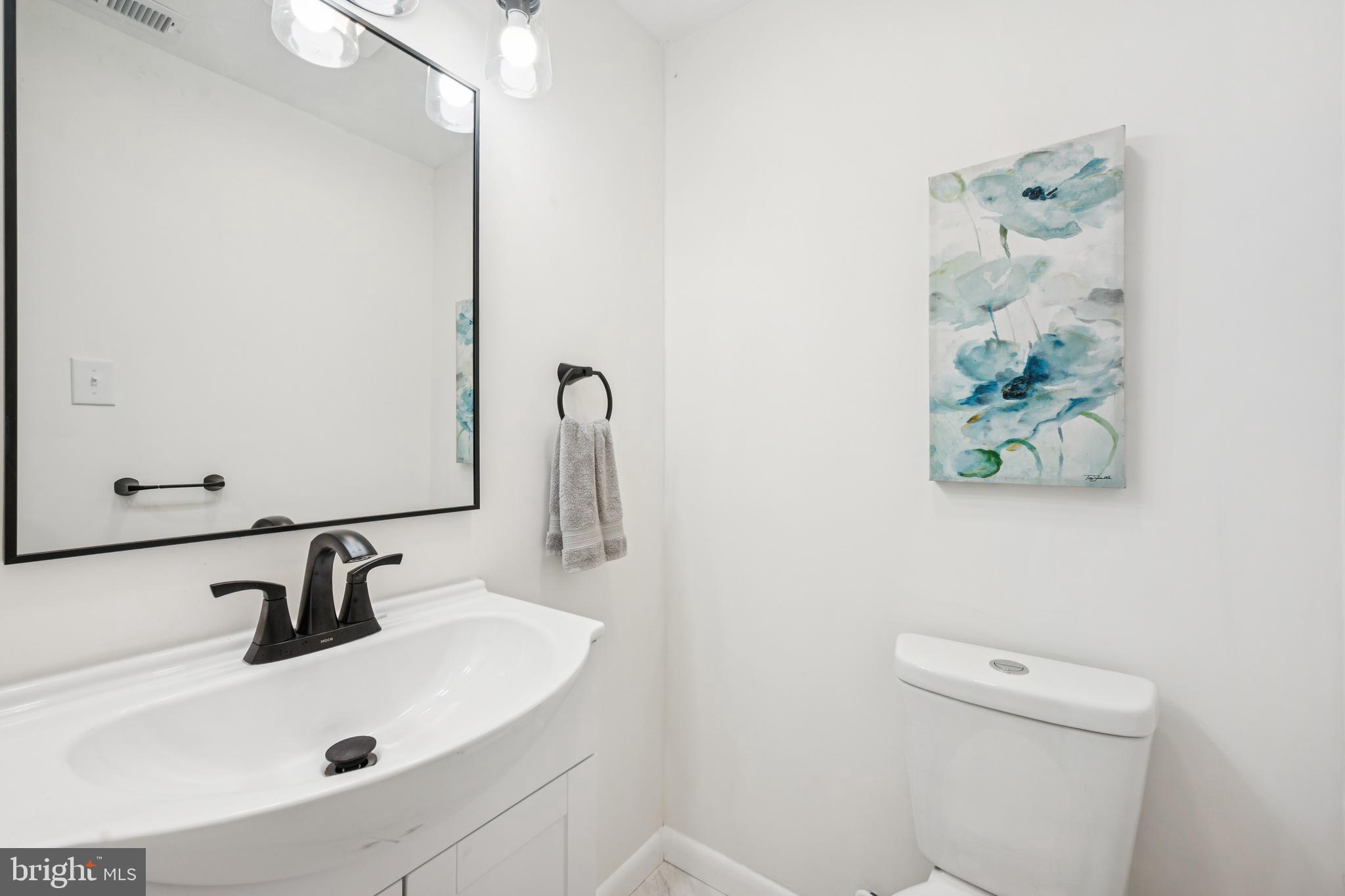 651 Erial Road Sicklerville, NJ 08081 - Photo 12 of 24 a bathroom with a sink and a mirror