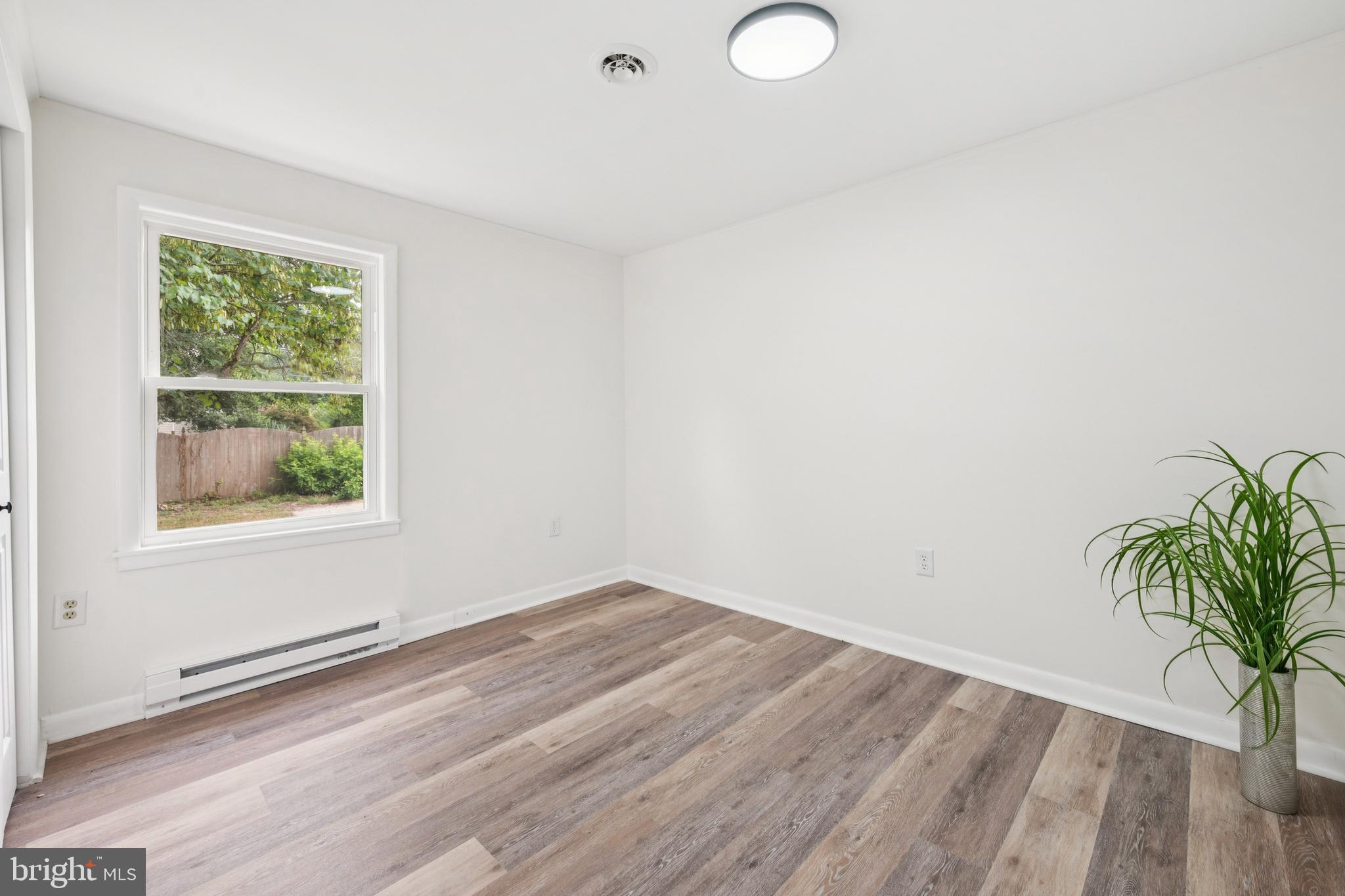 651 Erial Road Sicklerville, NJ 08081 - Photo 15 of 24 an empty room with wooden floor and windows
